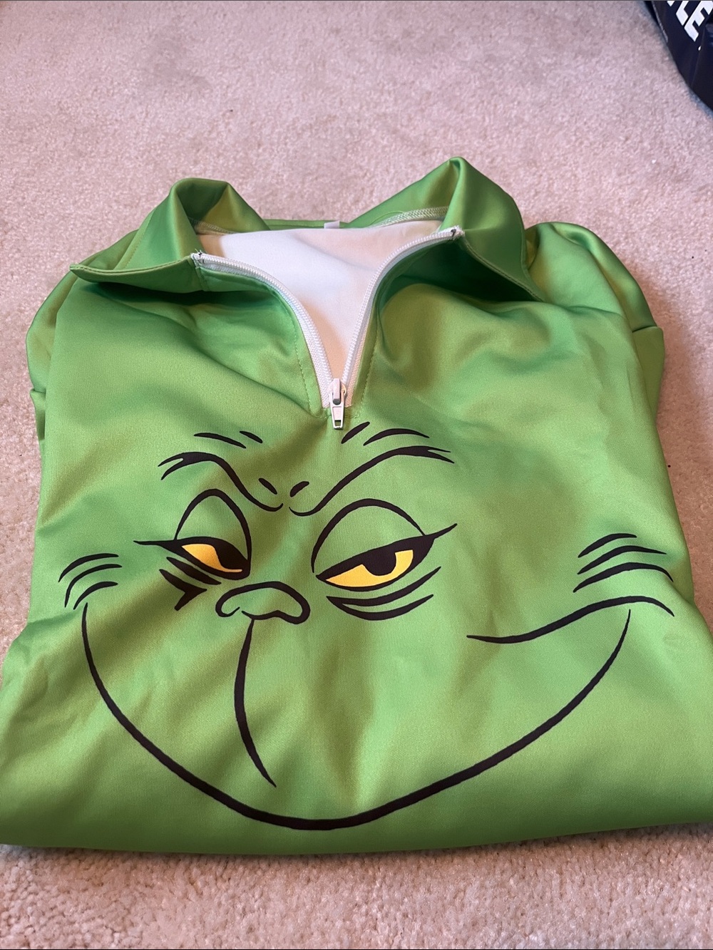 Grinch Green Zip-Front Top with Grinch Face. New. No tags. See pics.